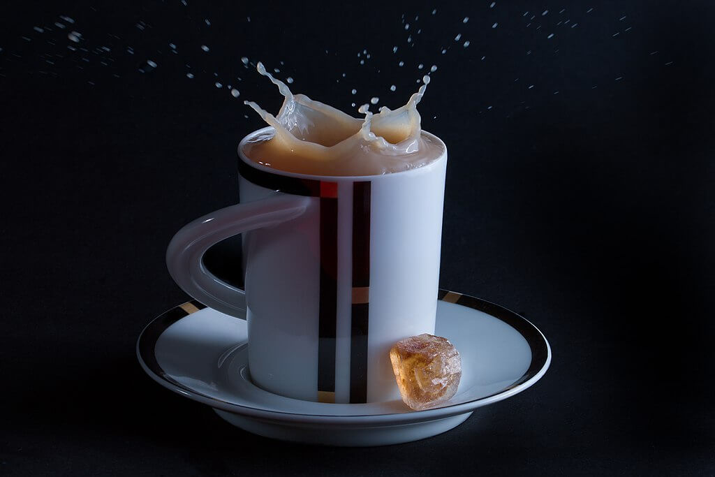 Tea splashing out of a cup
