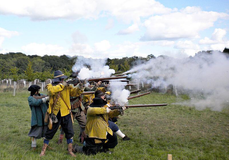 Modern reenactors demonstrating musket volley fire